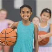 Young girl holding a basketball