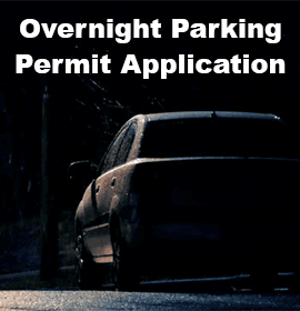 Car parked on street under street light